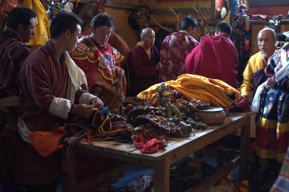 Various masks and impements for the dances are arrayed around the room.